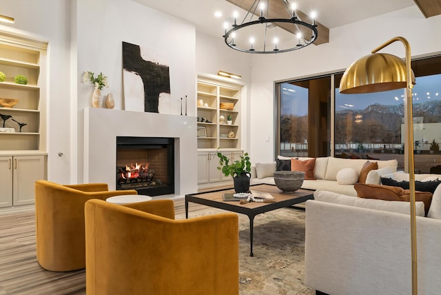 living room with light hardwood / wood-style floors and a fireplace