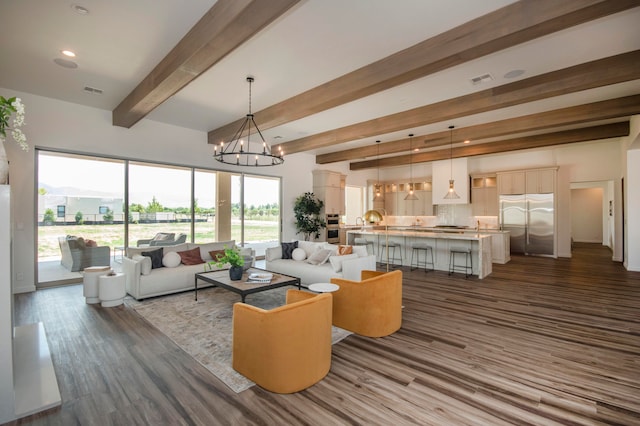 living room with beamed ceiling, a notable chandelier, and dark hardwood / wood-style flooring