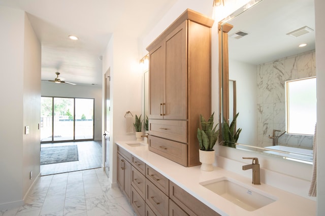 bathroom with vanity, ceiling fan, hardwood / wood-style flooring, and a washtub