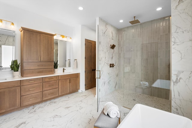 bathroom featuring vanity and separate shower and tub