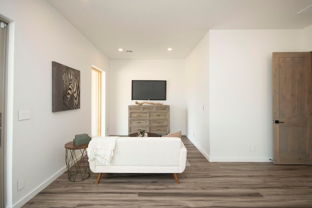 sitting room featuring dark hardwood / wood-style floors