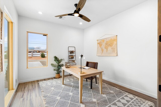 office space featuring ceiling fan and hardwood / wood-style flooring