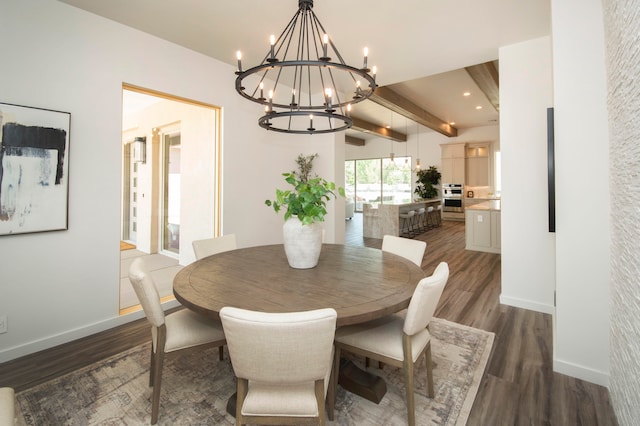 dining area with beamed ceiling, a chandelier, and dark hardwood / wood-style floors