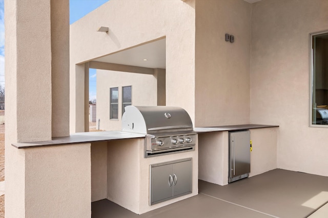 view of patio with grilling area and exterior kitchen