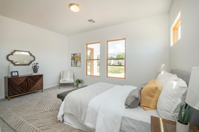 bedroom with light carpet