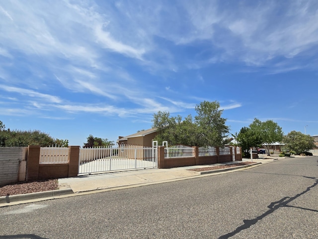 view of front of home featuring a fenced front yard and a gate