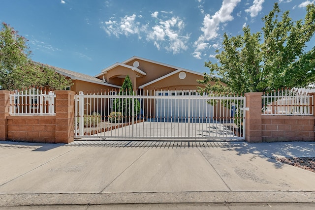 view of gate featuring a fenced front yard