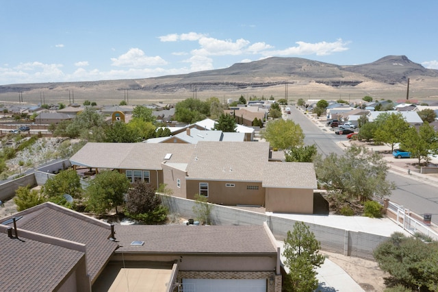 birds eye view of property with a mountain view and a residential view