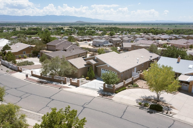 drone / aerial view with a residential view and a mountain view