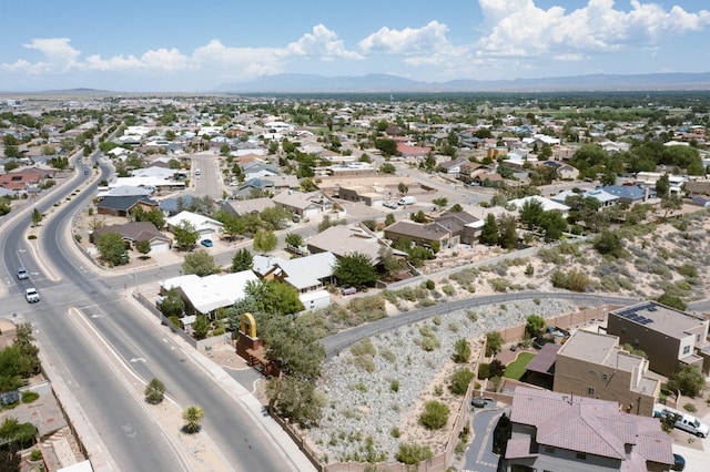 birds eye view of property with a mountain view and a residential view