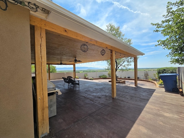 view of patio / terrace featuring outdoor dining space, ceiling fan, and a fenced backyard