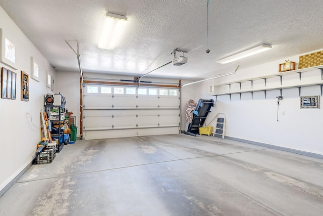 garage with baseboards and a garage door opener