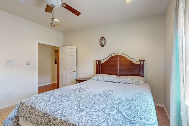 bedroom with baseboards and ceiling fan