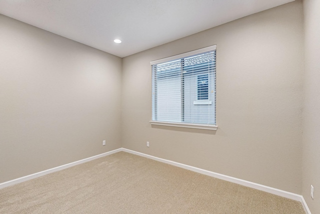 unfurnished room with recessed lighting, carpet flooring, and baseboards