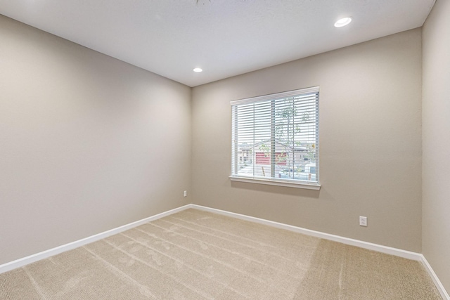 unfurnished room with recessed lighting, carpet flooring, and baseboards