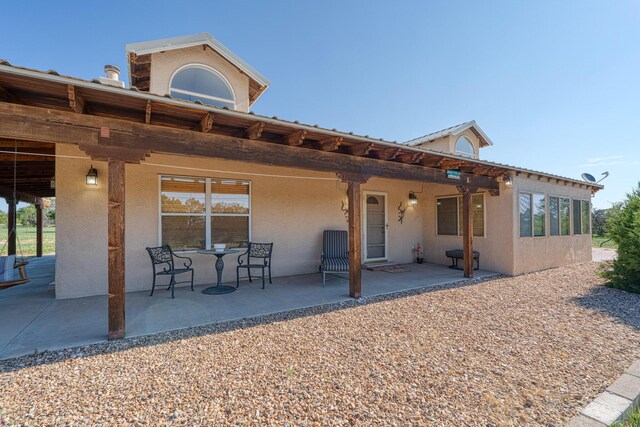 back of house featuring a patio area