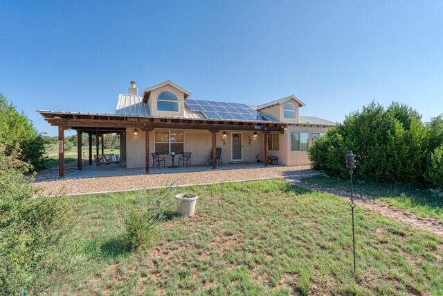 rear view of house with a patio area and a yard