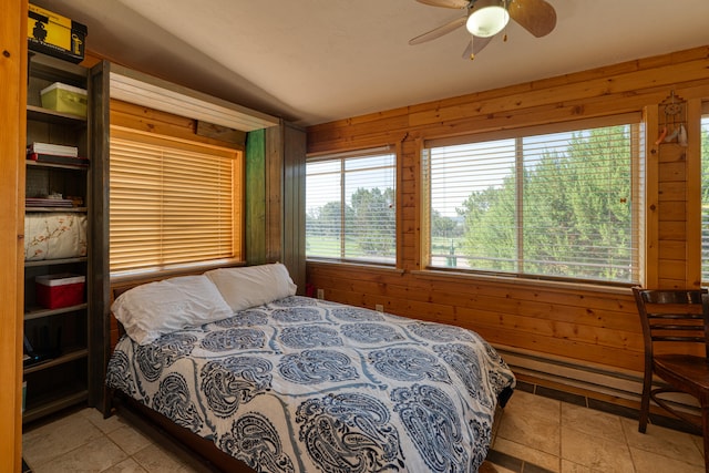 tiled bedroom with ceiling fan