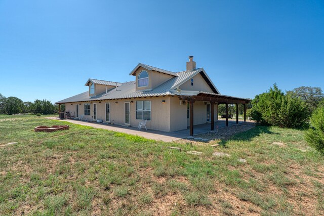 view of home's exterior with a patio and a yard