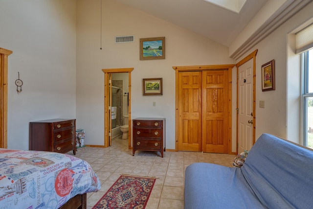 bedroom with light tile patterned floors, high vaulted ceiling, connected bathroom, visible vents, and baseboards