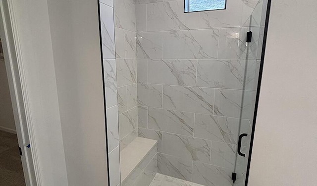 full bath featuring a shower stall