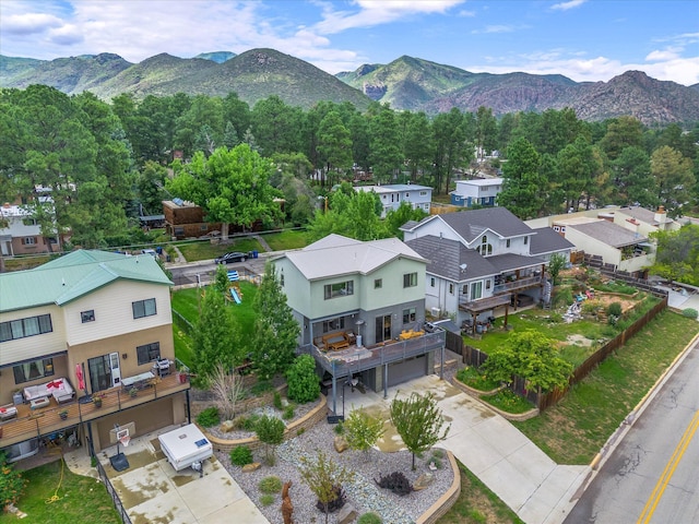 birds eye view of property with a mountain view