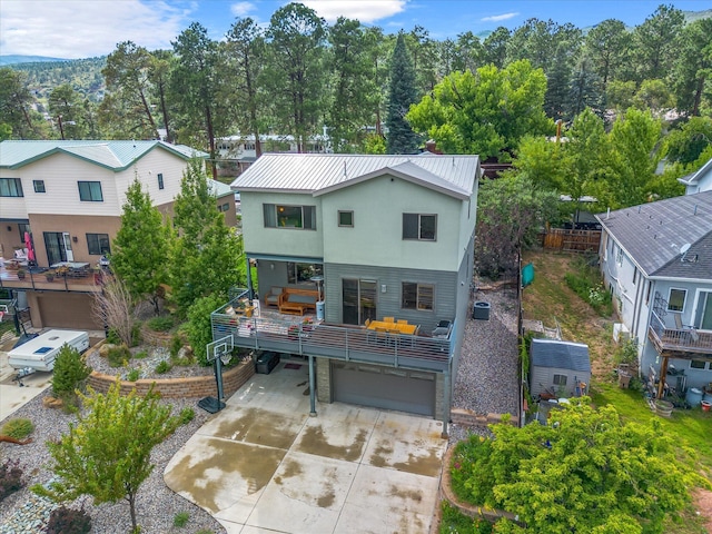 back of property with a garage