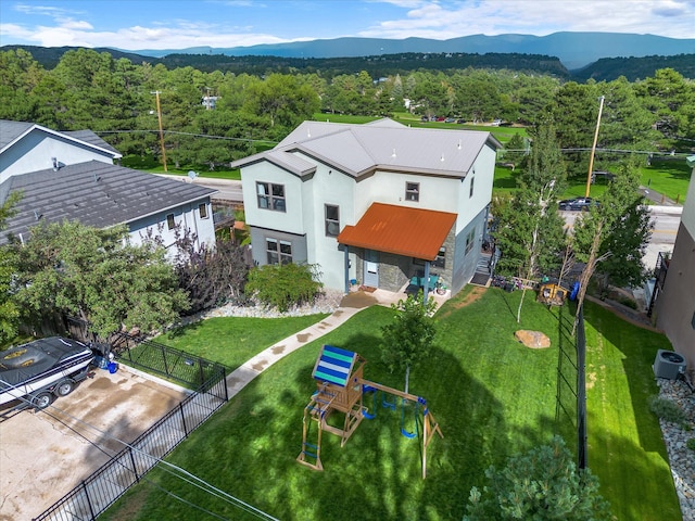 birds eye view of property with a mountain view