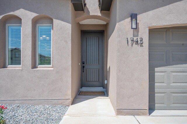 property entrance featuring a garage