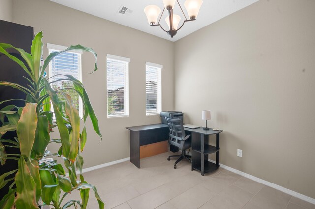 tiled home office with a notable chandelier