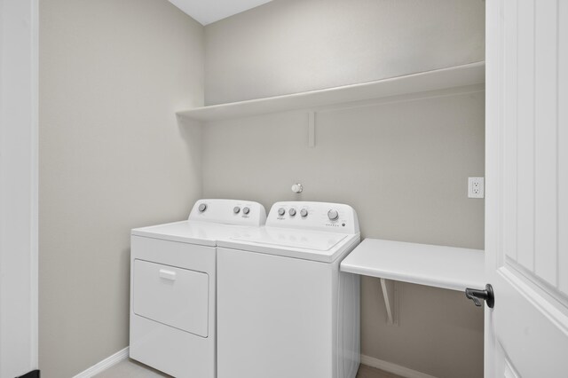 laundry room with independent washer and dryer