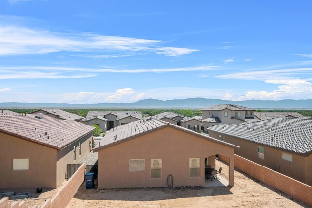 birds eye view of property with a mountain view