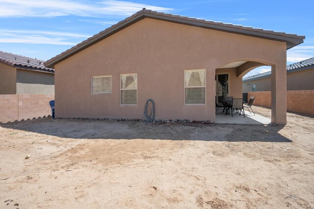 back of house featuring a patio