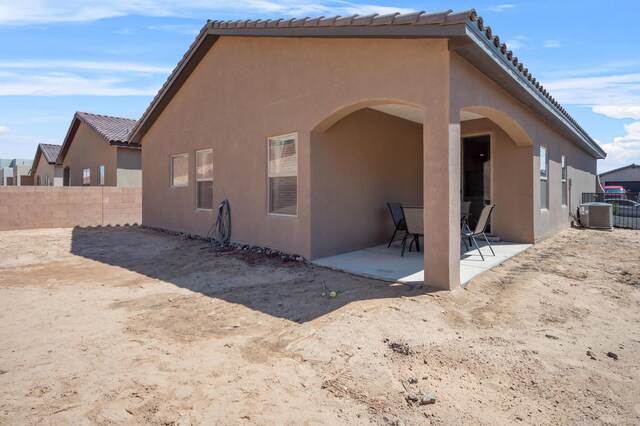 back of property featuring a patio area and central air condition unit