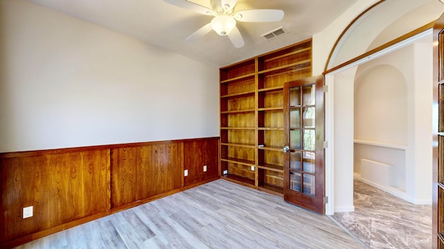 unfurnished room featuring ceiling fan and light wood-type flooring