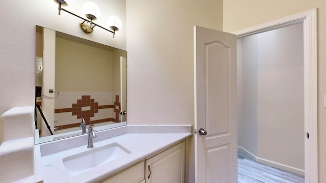 bathroom featuring wood-type flooring and vanity