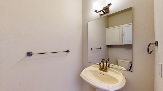 bathroom with sink and toilet