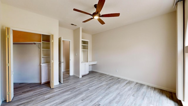 unfurnished bedroom with ceiling fan, a closet, and light hardwood / wood-style floors