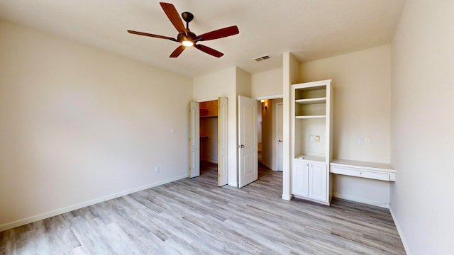 unfurnished bedroom featuring ceiling fan and light hardwood / wood-style floors