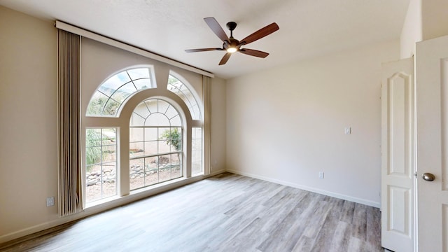 unfurnished room with light hardwood / wood-style flooring and ceiling fan