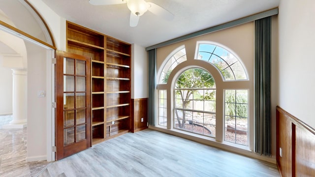 doorway to outside with ceiling fan and light hardwood / wood-style flooring