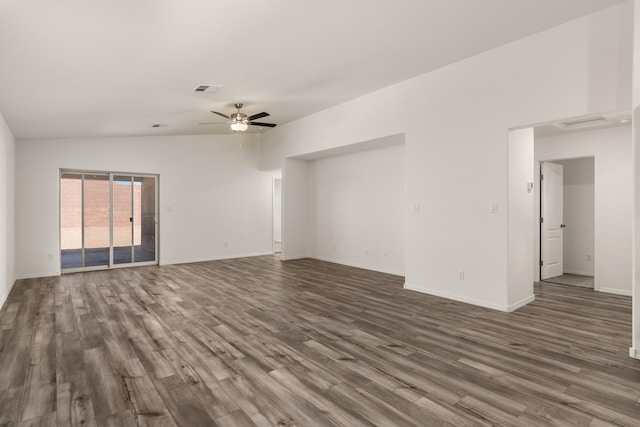 empty room featuring ceiling fan, dark wood-type flooring, visible vents, and baseboards