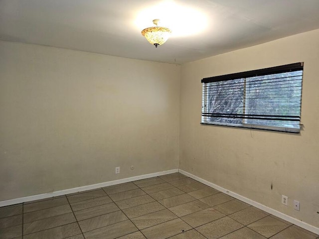 empty room with baseboards