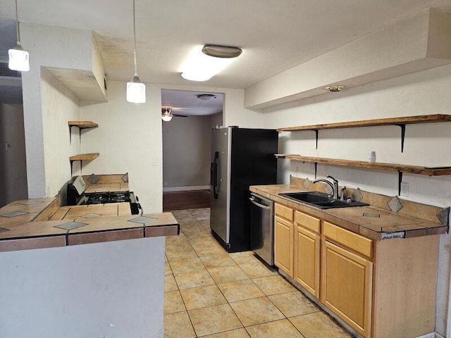 kitchen featuring open shelves, a sink, stainless steel appliances, light tile patterned flooring, and hanging light fixtures