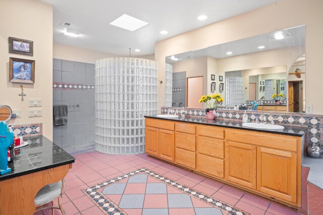 bathroom with tile patterned flooring and double sink vanity