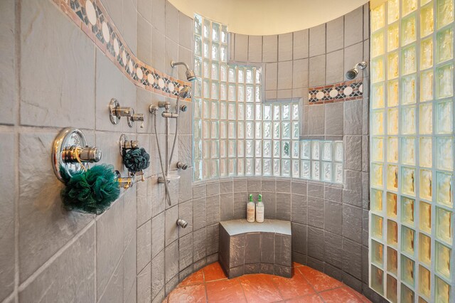 bathroom with tile walls and tile patterned floors