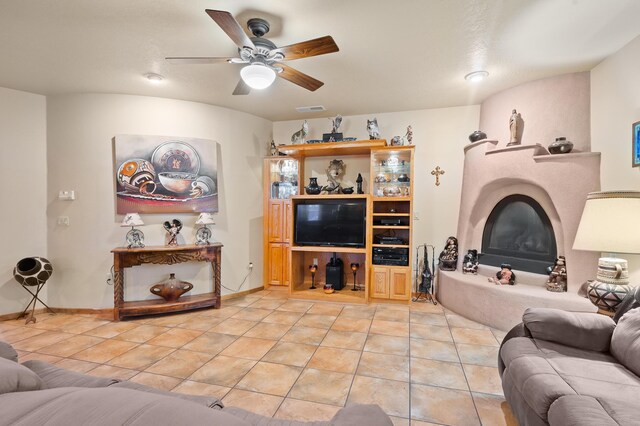 tiled living room featuring ceiling fan