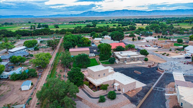 birds eye view of property with a mountain view