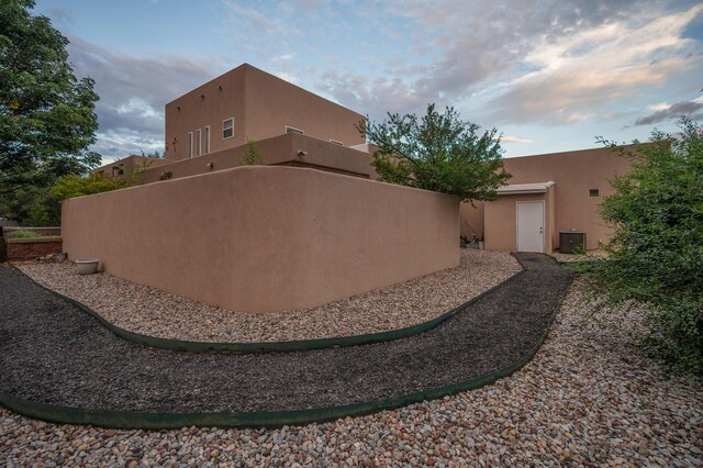 view of property exterior at dusk