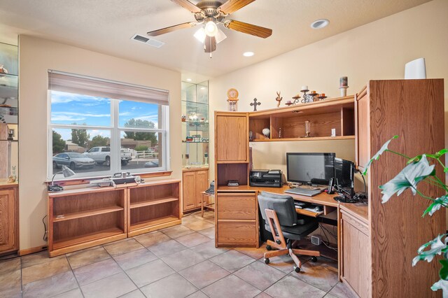 tiled home office with ceiling fan